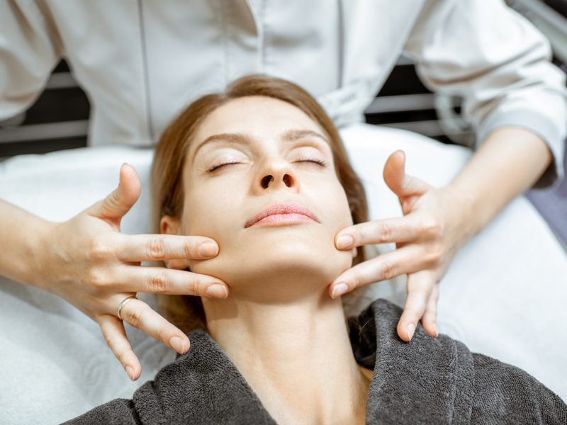 Woman during the facial massage at the beaty salon